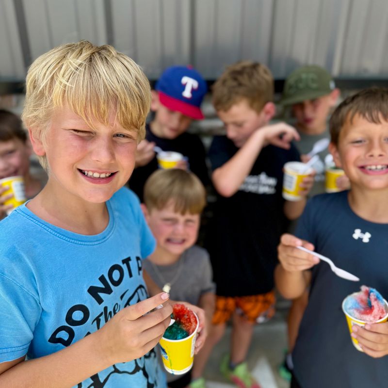 Kids enjoying snow cones during a day at Sky